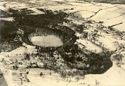 An aerial photo looking approximately southeast of Glacier Lake and Dry Lake in the mid-1930s (Sydansk 1936). Hemlock trees identifiable on this photo were found to have died, apparently owing to high water levels during the 1990s. The Dry Lake basin is marked B. Note the agricultural use on the watershed, part of which extends off the picture to the right.
